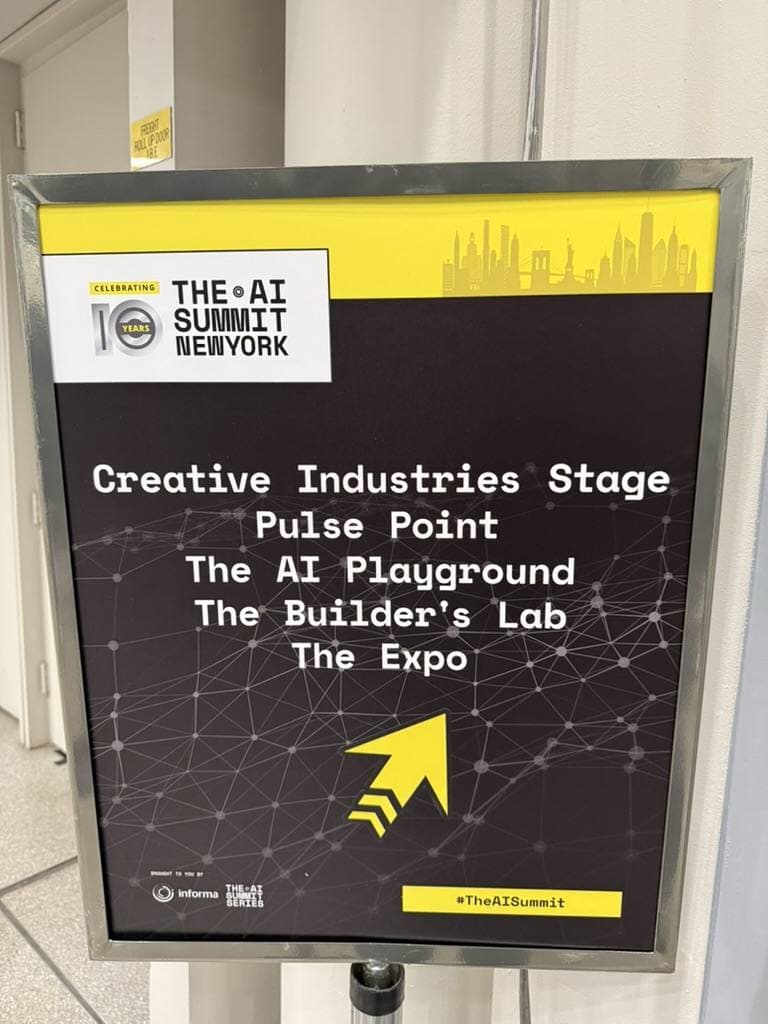 Signage at The AI Summit New York 2025 listing the Creative Industries Stage, AI Playground, and Builder's Lab