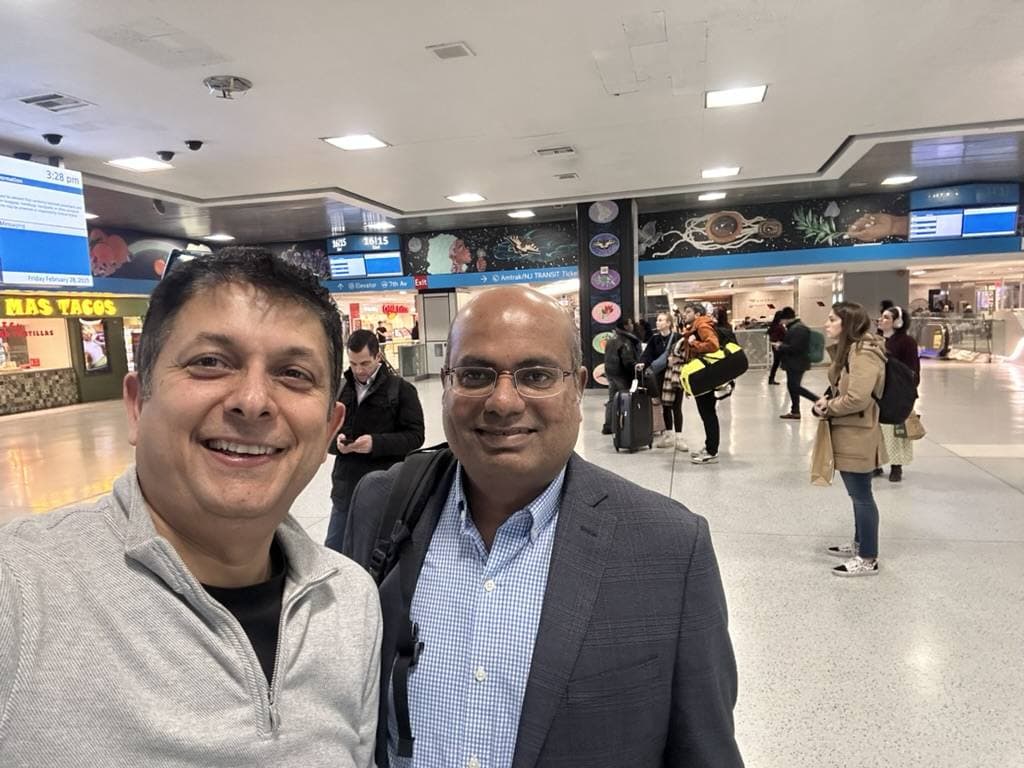 Aruneesh Salhotra with a colleague while traveling between events
