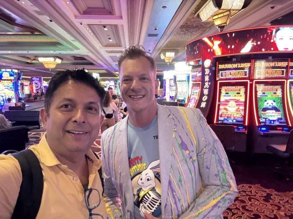 Aruneesh Salhotra with a colleague at a Las Vegas conference