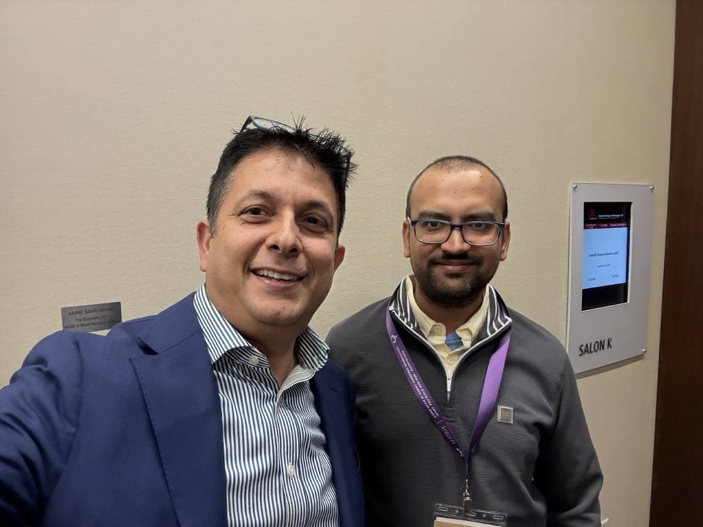Aruneesh Salhotra with a colleague on a New York City street during a conference