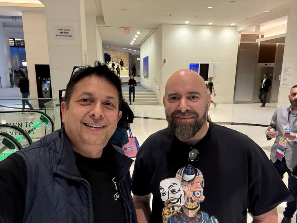 Aruneesh Salhotra with a colleague at a conference venue in New York
