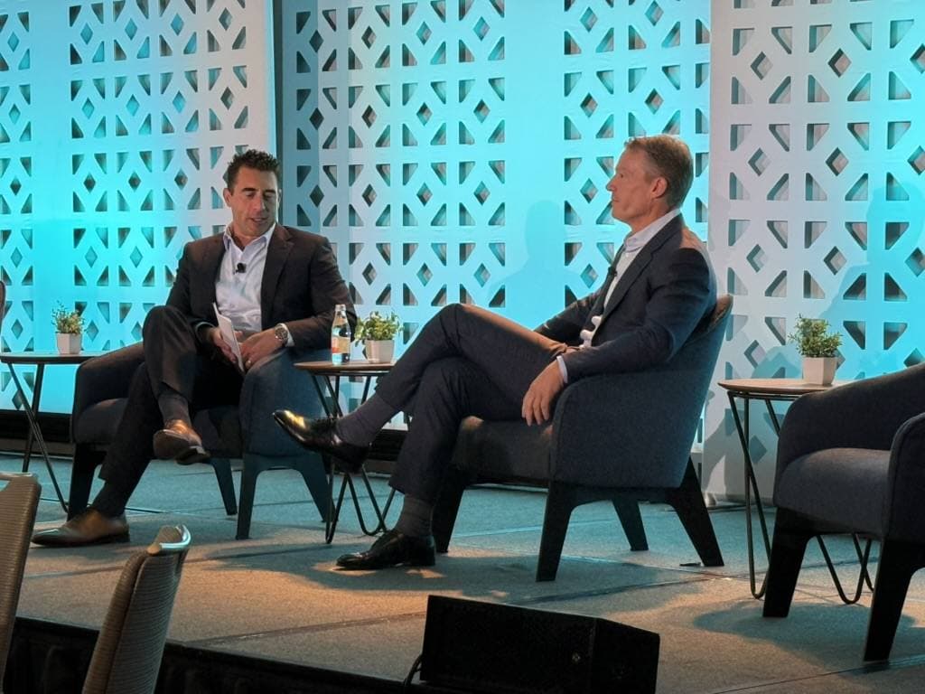 A fireside chat on stage at a conference Aruneesh Salhotra attended