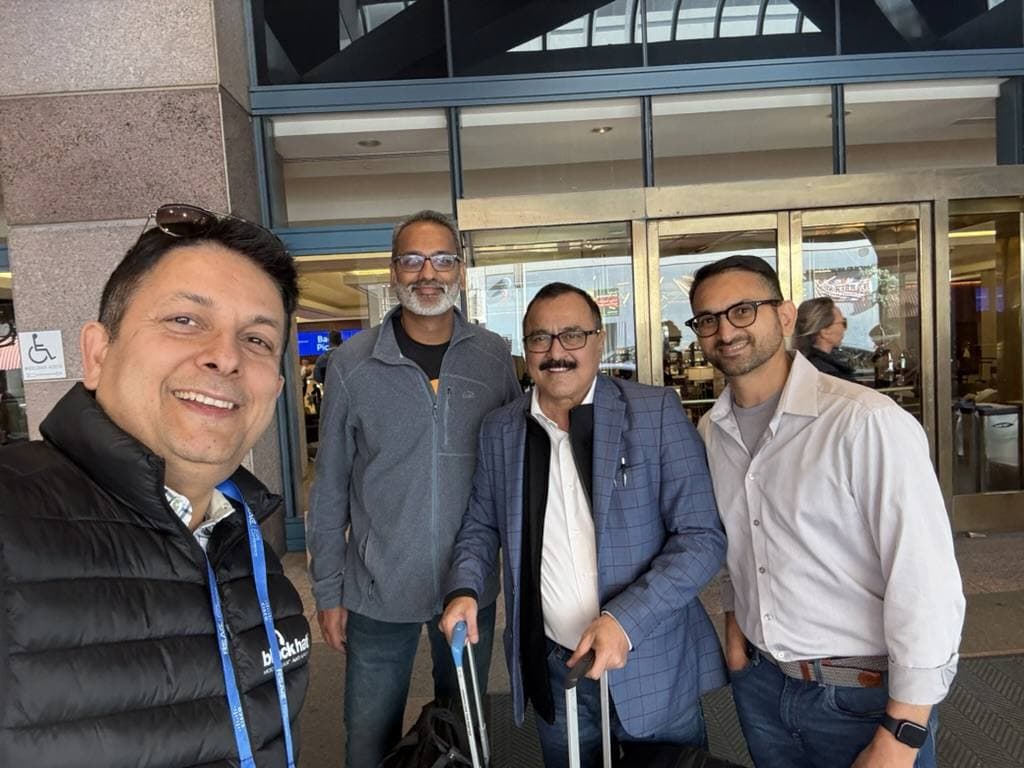 Aruneesh Salhotra with colleagues while traveling between events