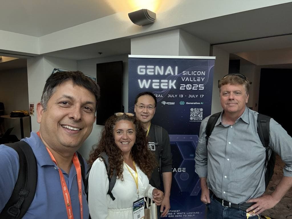 Aruneesh Salhotra with attendees by the GenAI Week Silicon Valley 2025 banner