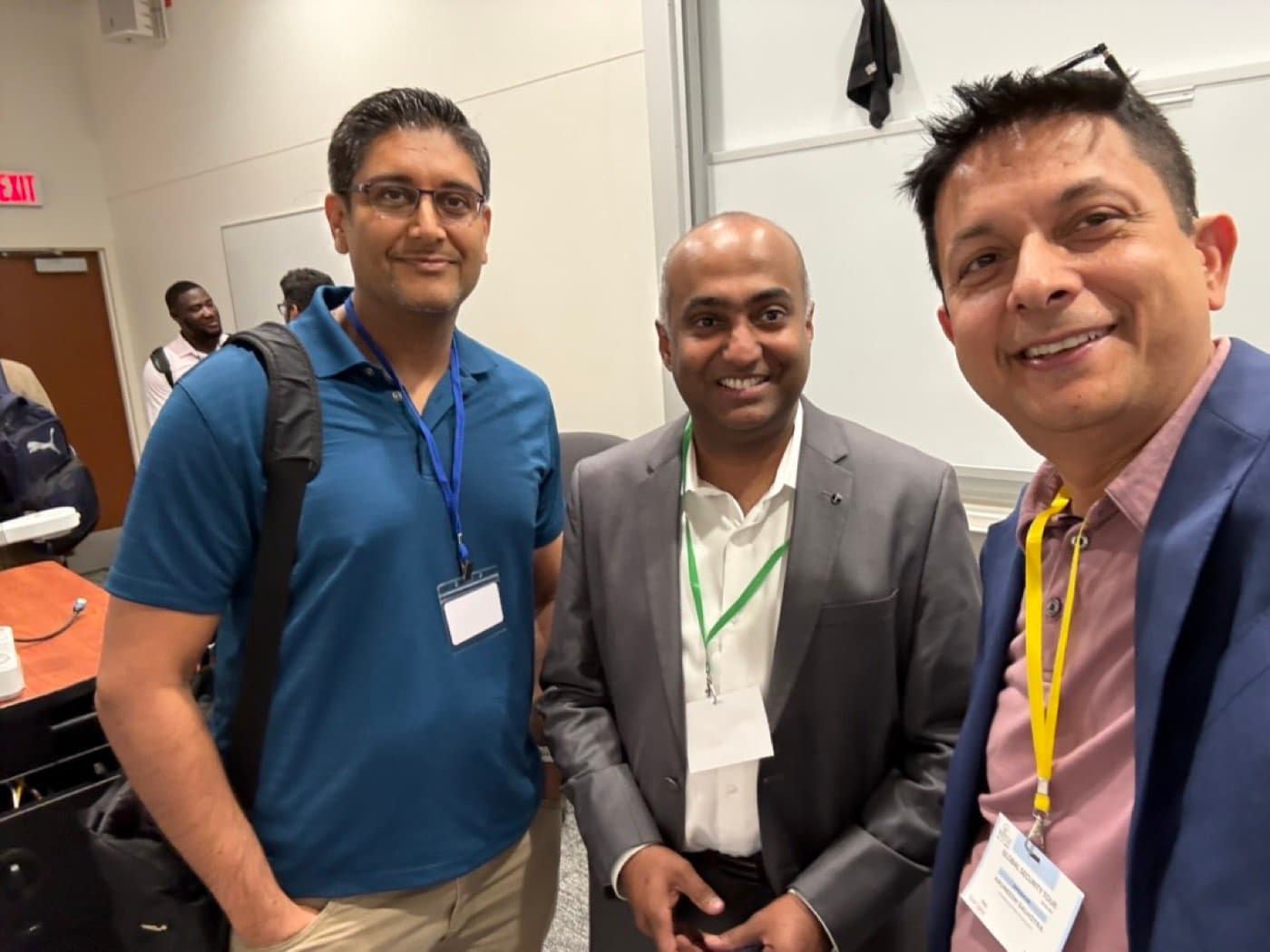 Aruneesh Salhotra with two colleagues at the Global Security Tour in Dallas