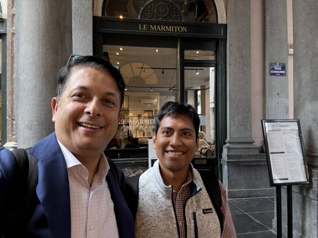 Aruneesh Salhotra with a colleague at a restaurant during the Open Source Congress in Brussels