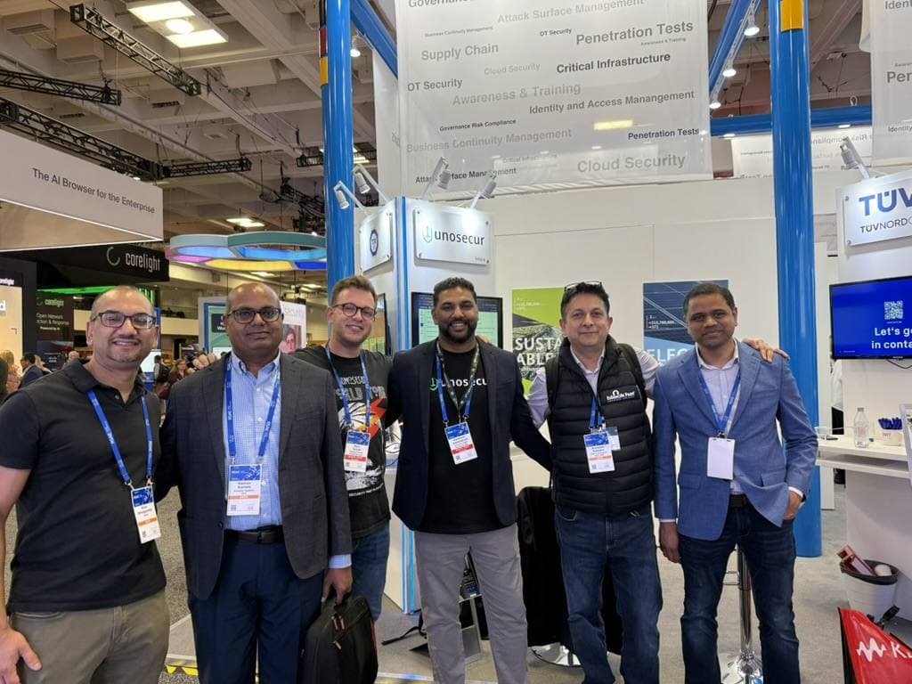 Aruneesh Salhotra with colleagues at a vendor booth on the RSAC 2026 expo floor