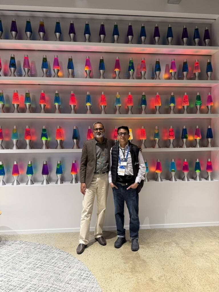 Aruneesh Salhotra with a colleague at a lava-lamp installation at RSAC 2026