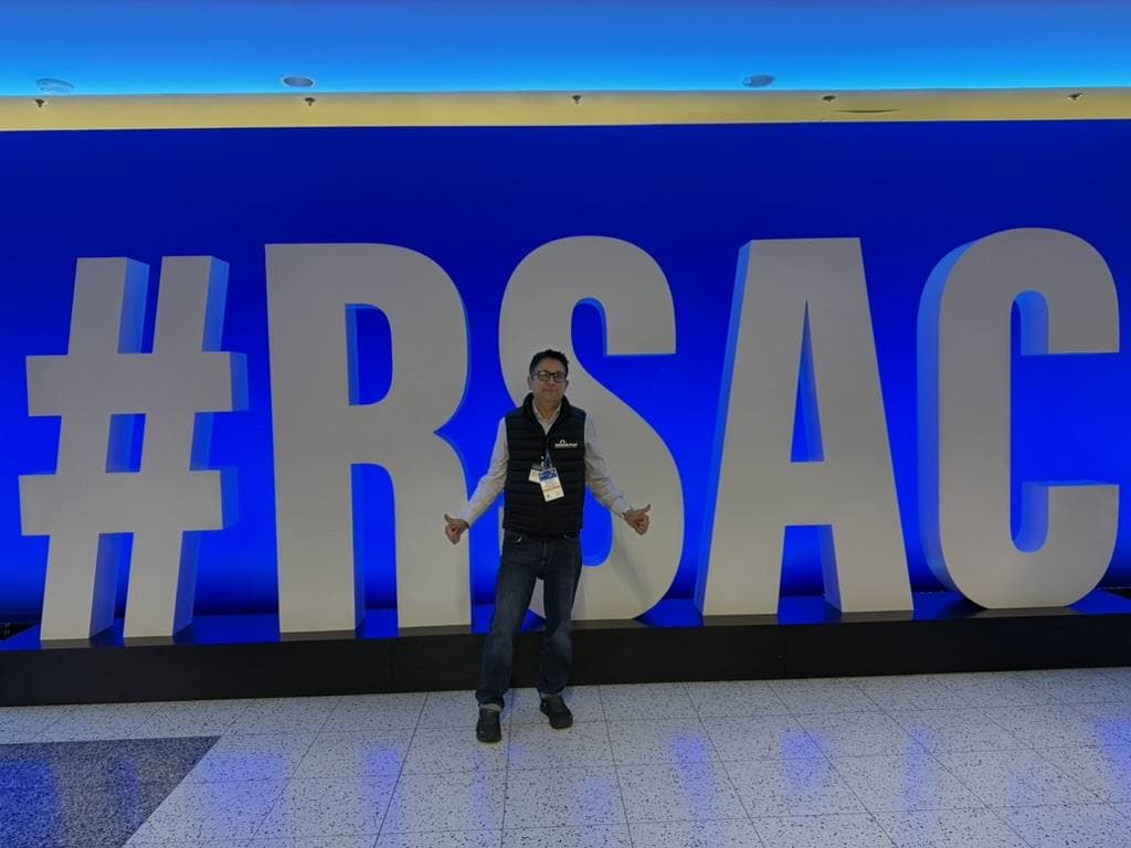 Aruneesh Salhotra in front of the #RSAC letters at RSAC 2026